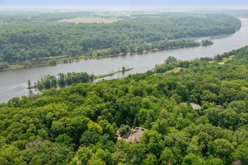 Set on the bluffs of the St. Croix River, this extraordinary property is designed to impress and built to inspire.