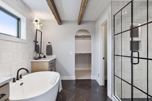 Primary Bath with Walk-In Closet *photo of like home