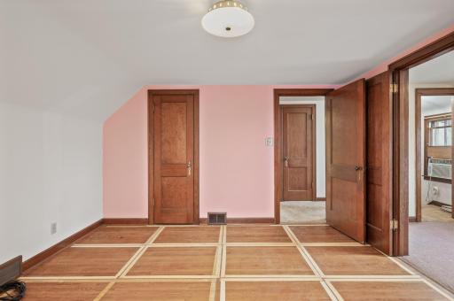 Upper level bedroom with a walk in closet