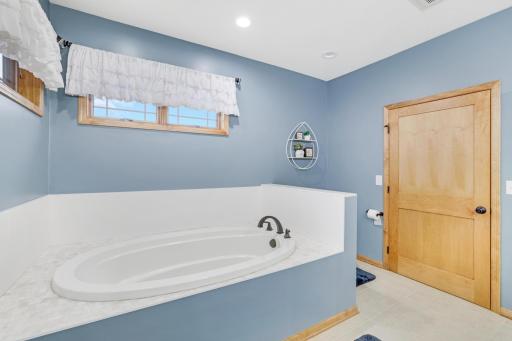 Primary bathroom complete with a luxurious walk-in tile shower, double sinks and spacious soaking tub. Transform your daily rituals into a spa-like experience!
