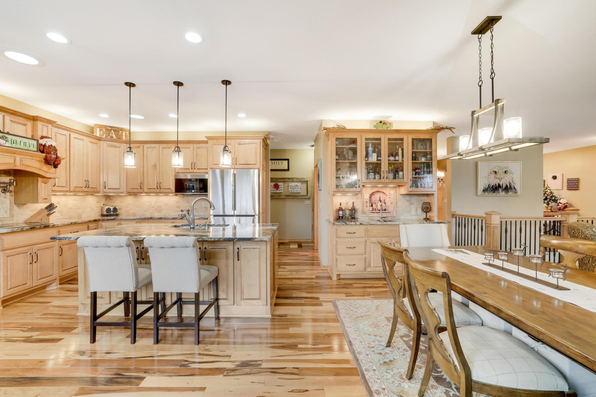 The kitchen is truly a chef's dream! With plenty of cabinets for all your storage needs and stylish stainless steel appliances, it's both functional and beauty. Plus, the built-in wet bar area makes it perfect for entertaining.