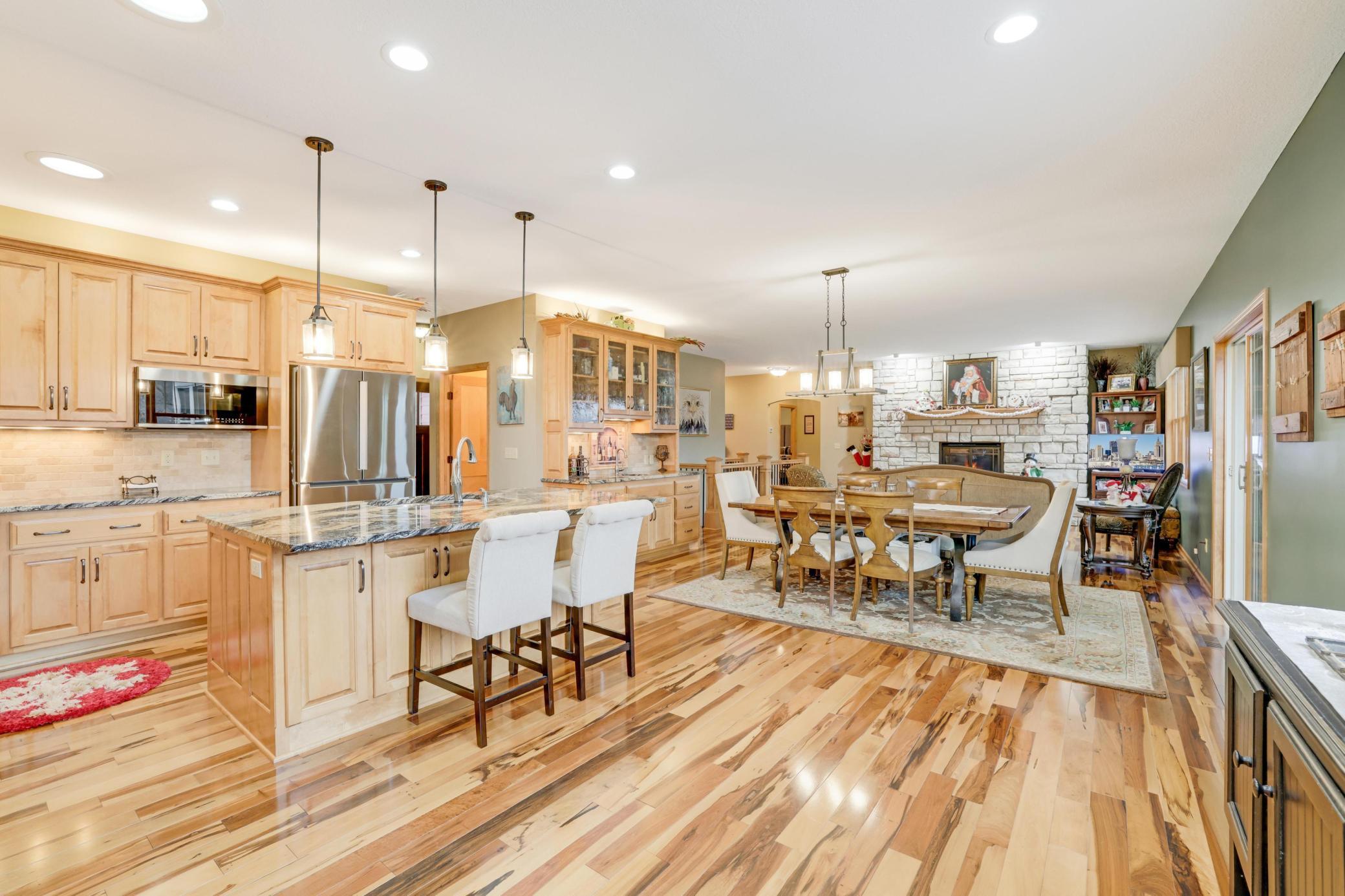 The kitchen is truly a chef's dream! With plenty of cabinets for all your storage needs and stylish stainless steel appliances, it's both functional and beauty. Plus, the built-in wet bar area makes it perfect for entertaining.