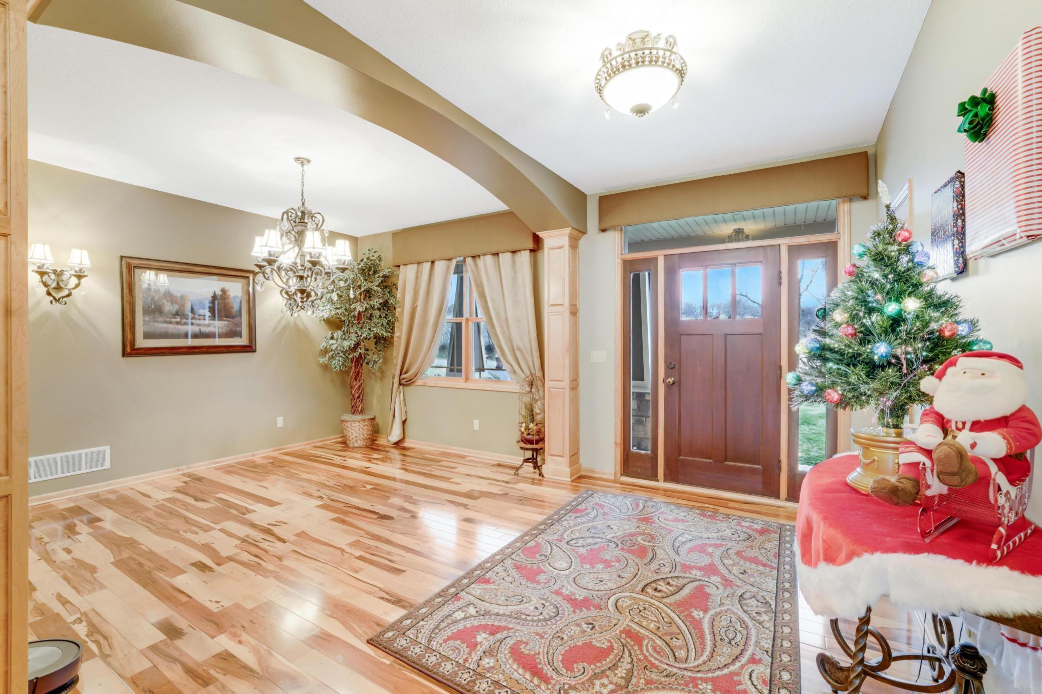 Inviting front entryway that welcomes you home, leading into a charming formal dining room perfect for gatherings and special meals.
