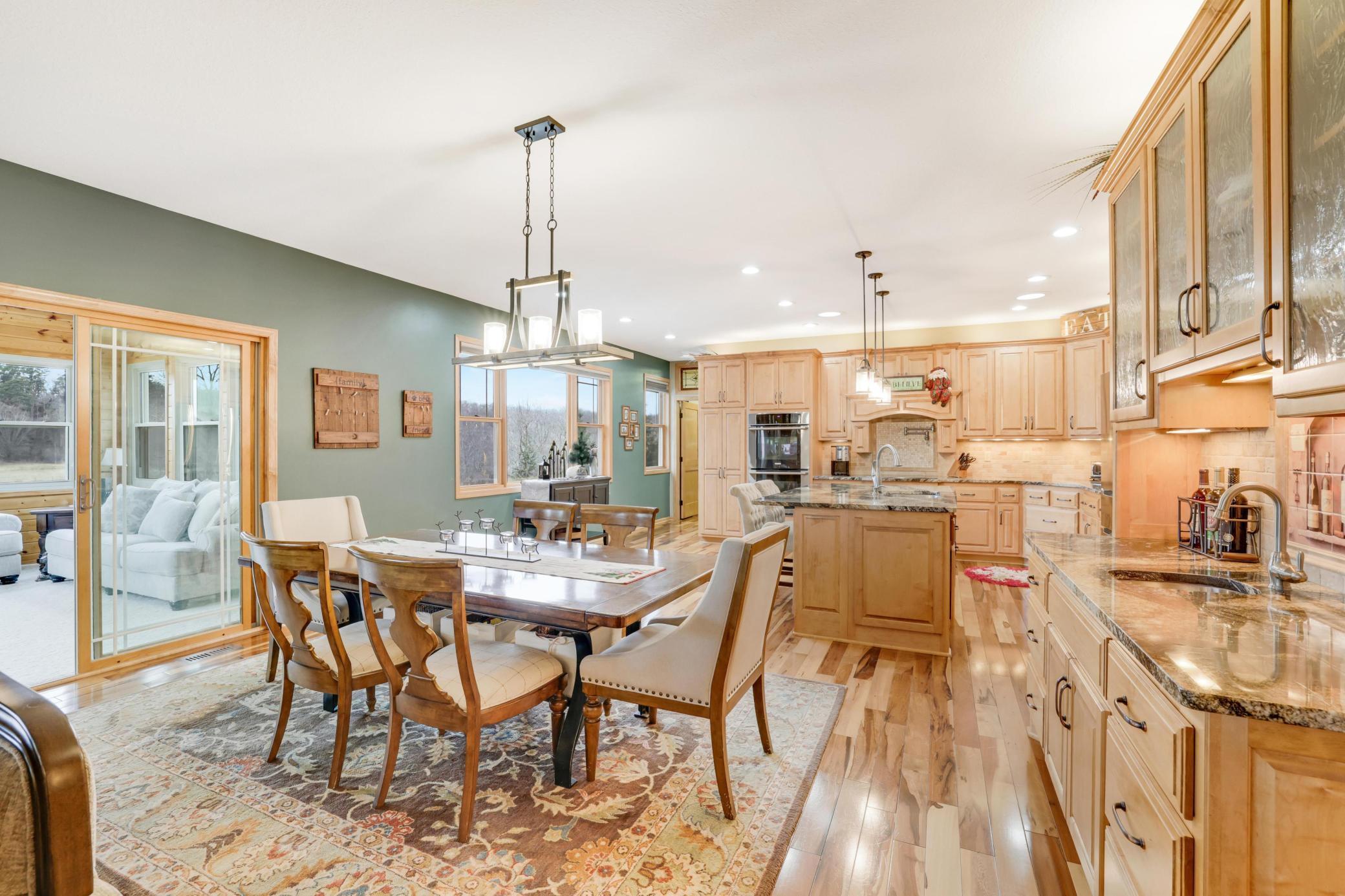 This beautifully designed main living area flows seamlessly into the spacious kitchen and informal dining area, creating the perfect backdrop for gatherings and everyday moment.