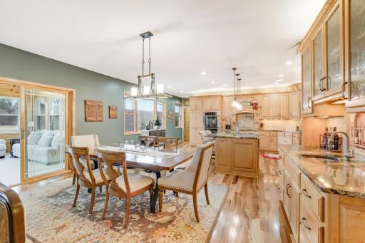 This beautifully designed main living area flows seamlessly into the spacious kitchen and informal dining area, creating the perfect backdrop for gatherings and everyday moment.