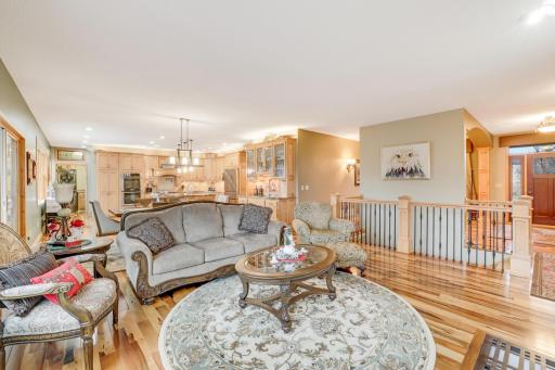 This beautifully designed main living area flows seamlessly into the spacious kitchen and informal dining area, creating the perfect backdrop for gatherings and everyday moment.