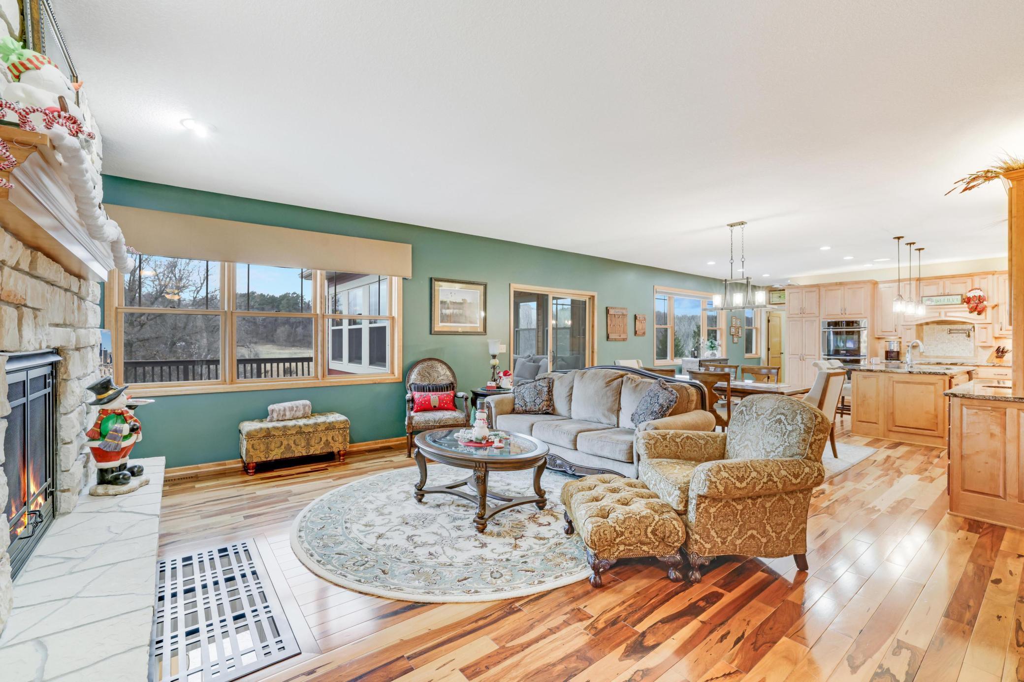 This beautifully designed main living area flows seamlessly into the spacious kitchen and informal dining area, creating the perfect backdrop for gatherings and everyday moment.