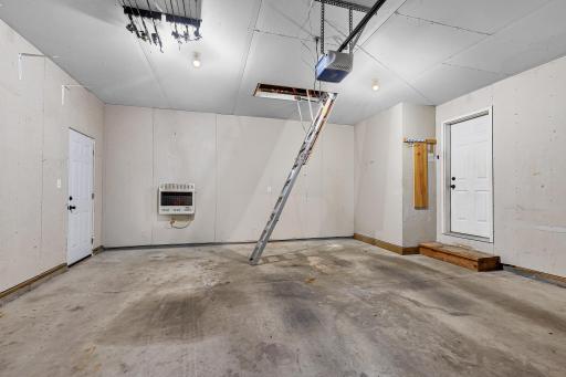 Pull down ladder in the garage with access to the attic.