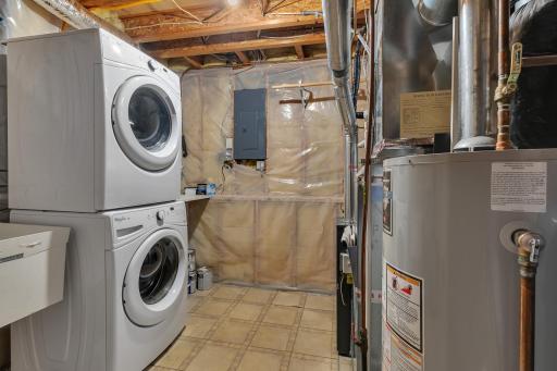 Laundry room doubles as a mechanical room.