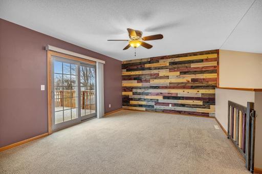 Upper living room walks out to the back deck.