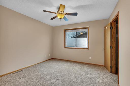 Primary bedroom with a walk in closet and direct access to the full bathroom.