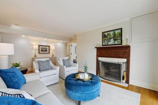 A cozy sitting room off the living room provides an additional gathering spot for quiet conversations and reading by the fireplace