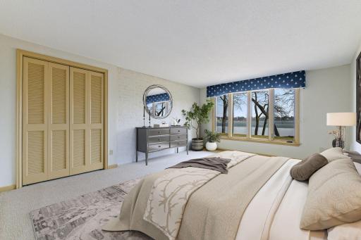 Two additional bedrooms are located in the lower level, both with new carpet, fresh paint, and lake views
