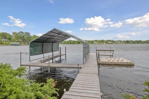 This private dock offers ample space for a boat, jet skis, and all your watercraft needs