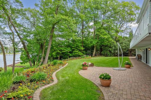 Expansive green spaces surround the property, offering a lush landscape