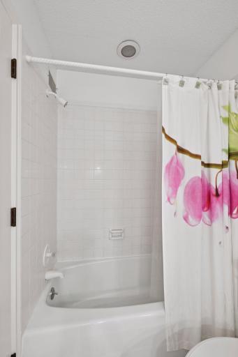 Full bathroom in the hallway of the upper level