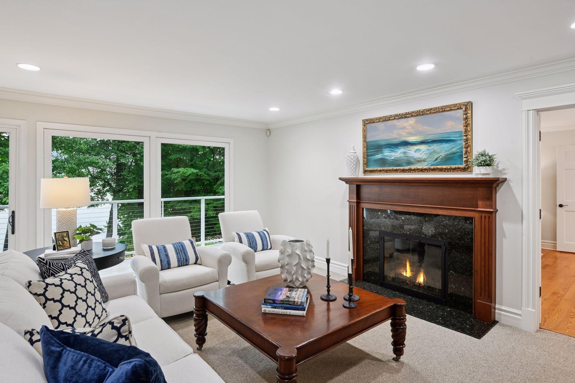 A cozy fireplace anchors one end of the living room
