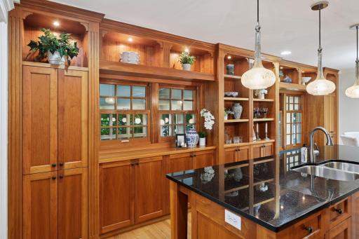 A wall of built-ins provides space for storage and displaying decorative treasures... plus views of the indoor pool