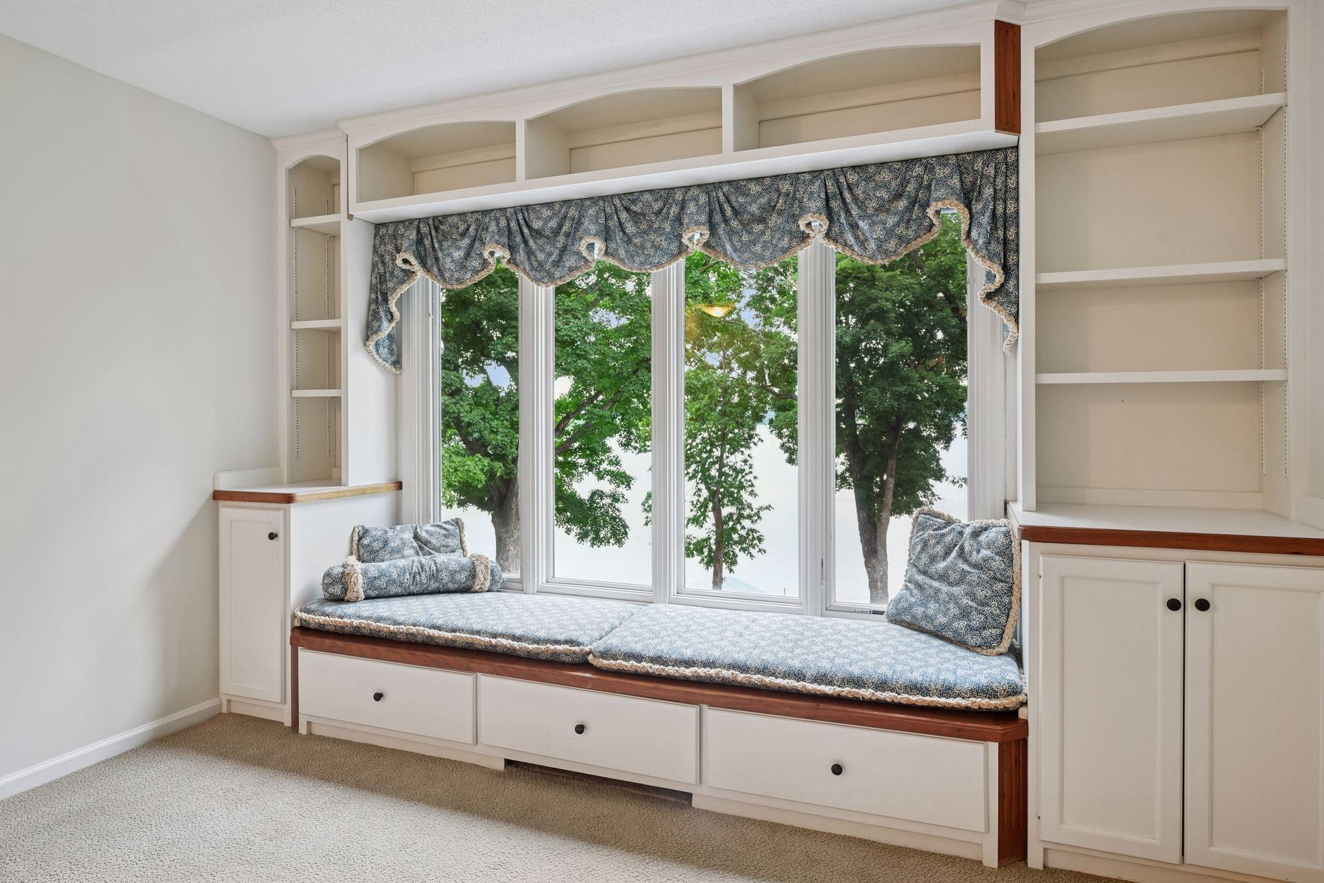 Enjoy the views of the lake from this built-in bench seating in the bedroom