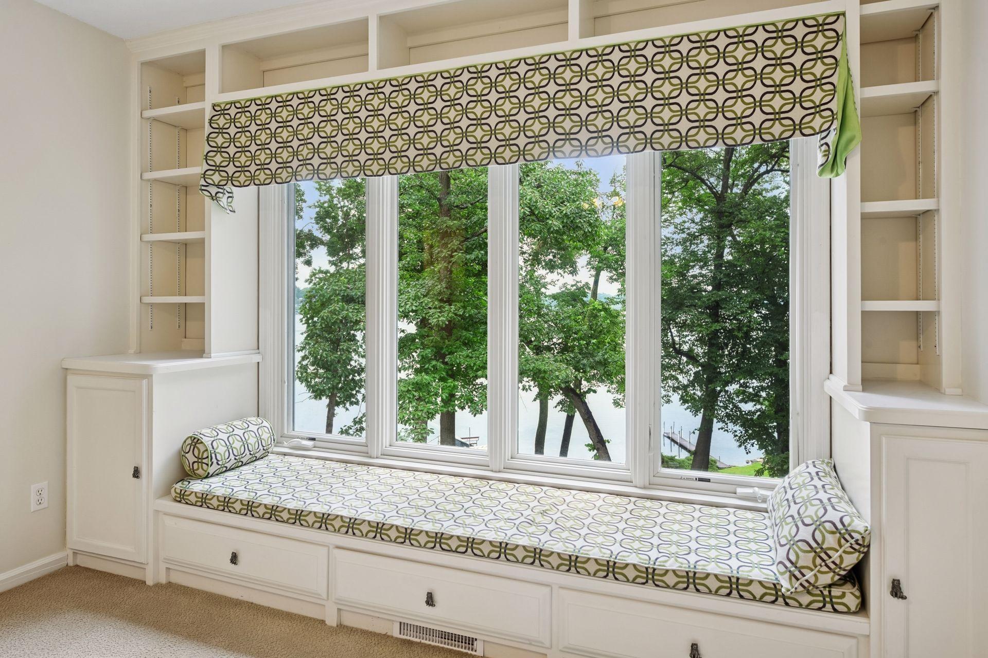 Enjoy the views of the lake from this built-in bench seating in the bedroom