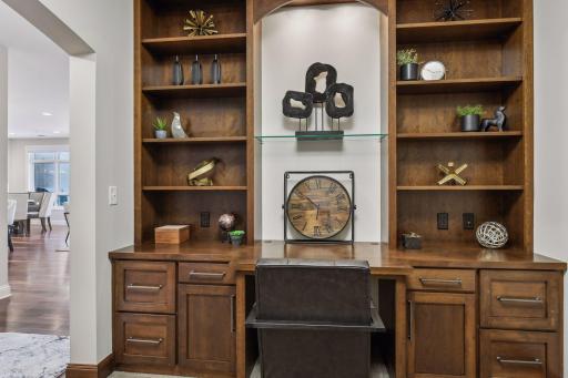 Custom built-in desk and shelving help to keep items organized