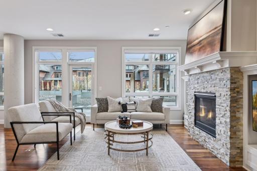 Filled with natural light, this space also has access to the oversized patio and direct access to common courtyard beyond