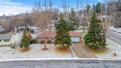 Lovely brick rambler surrounded by mature trees