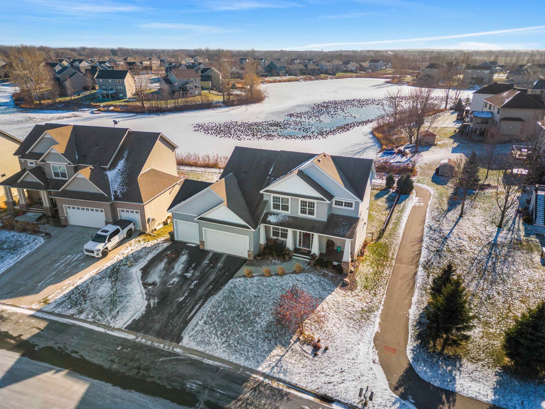 Welcome to this beautiful two-story home in the highly desired Mystic Meadows neighborhood on the shores of Lake Ann.