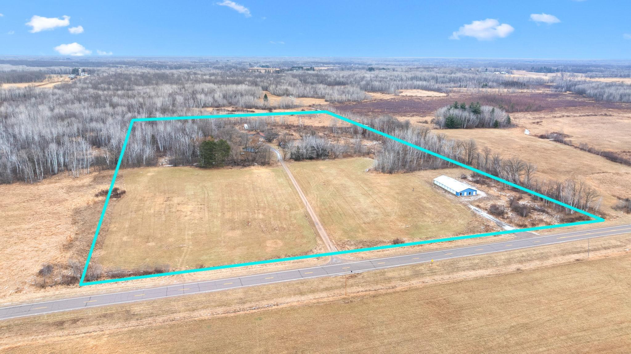 20 acres, 2 driveways, a charming home, pasture, and wooded.