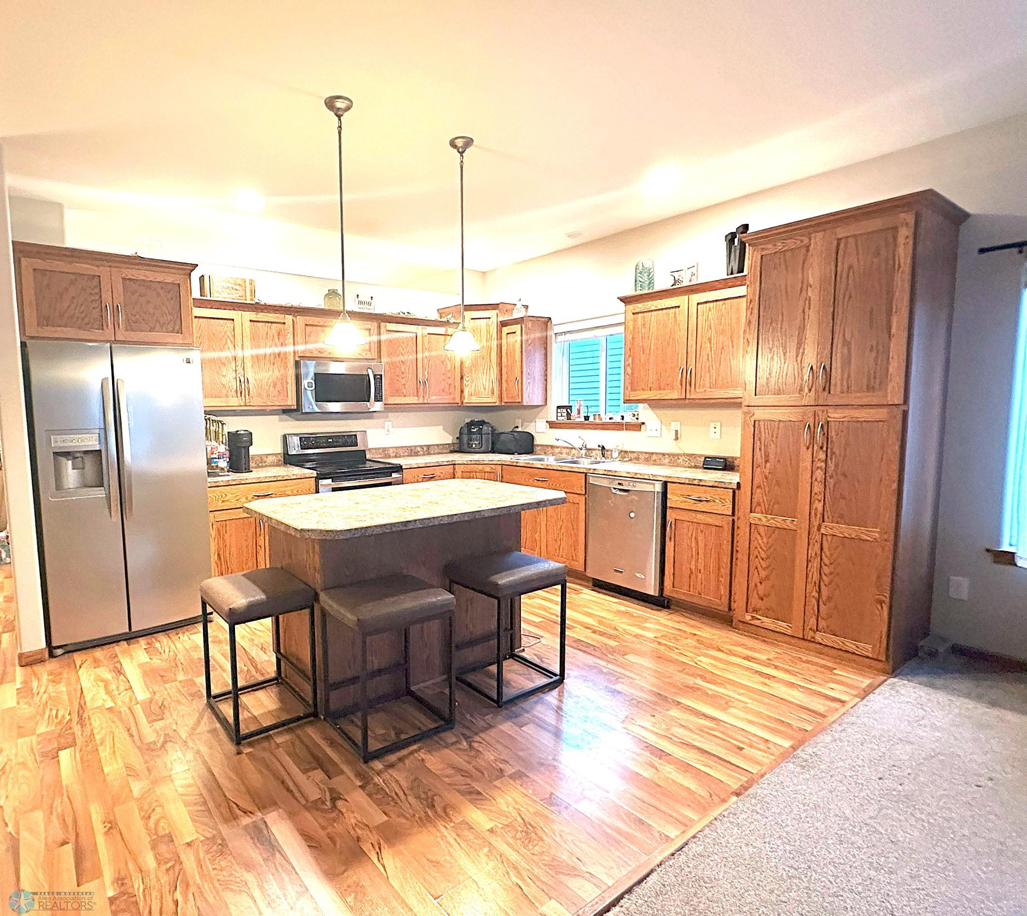 Kitchen with Island, Stainless Appliances, and lots of cabinet space