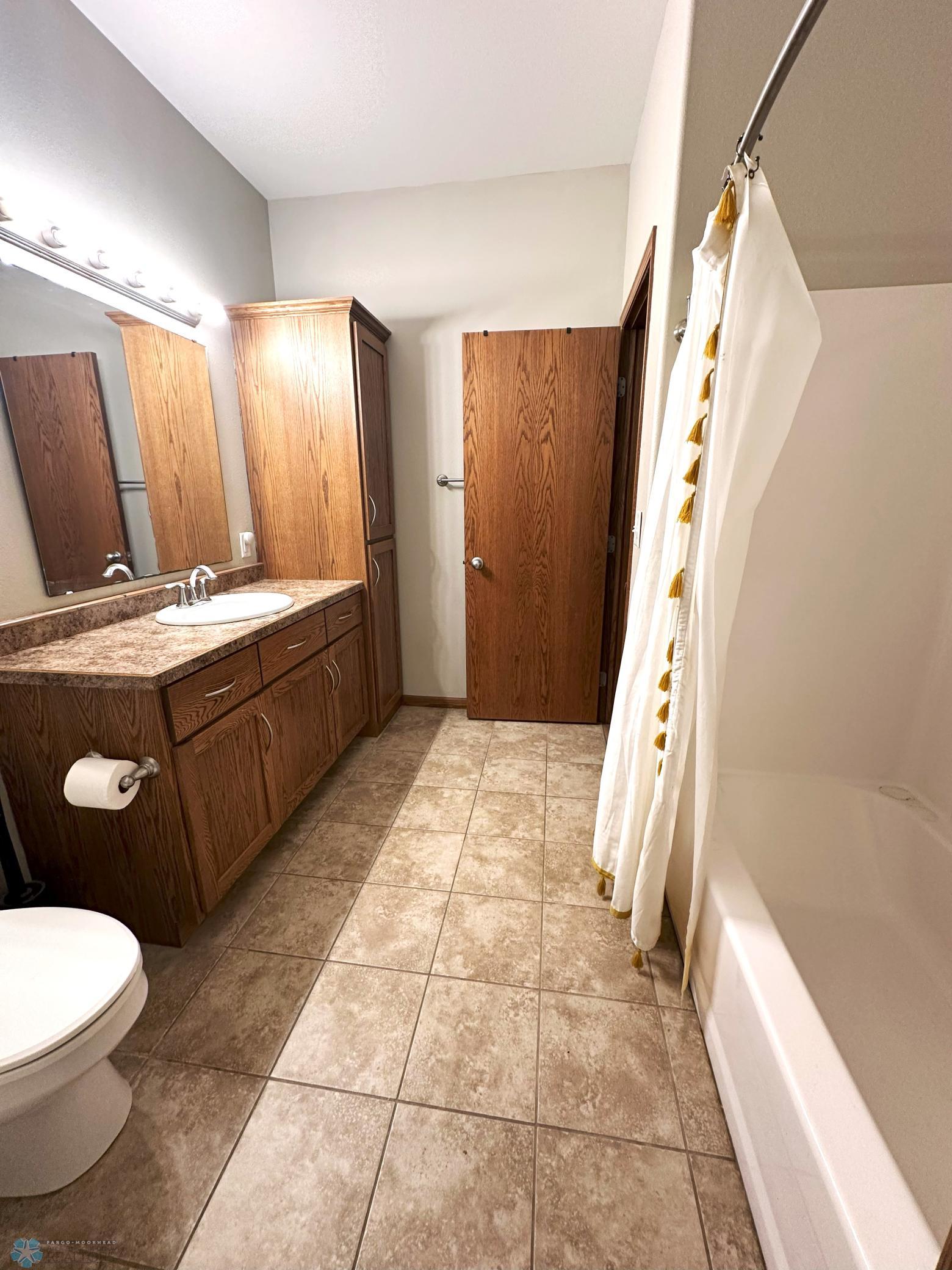 Upper Level Full Bath opens to Primary Bedroom