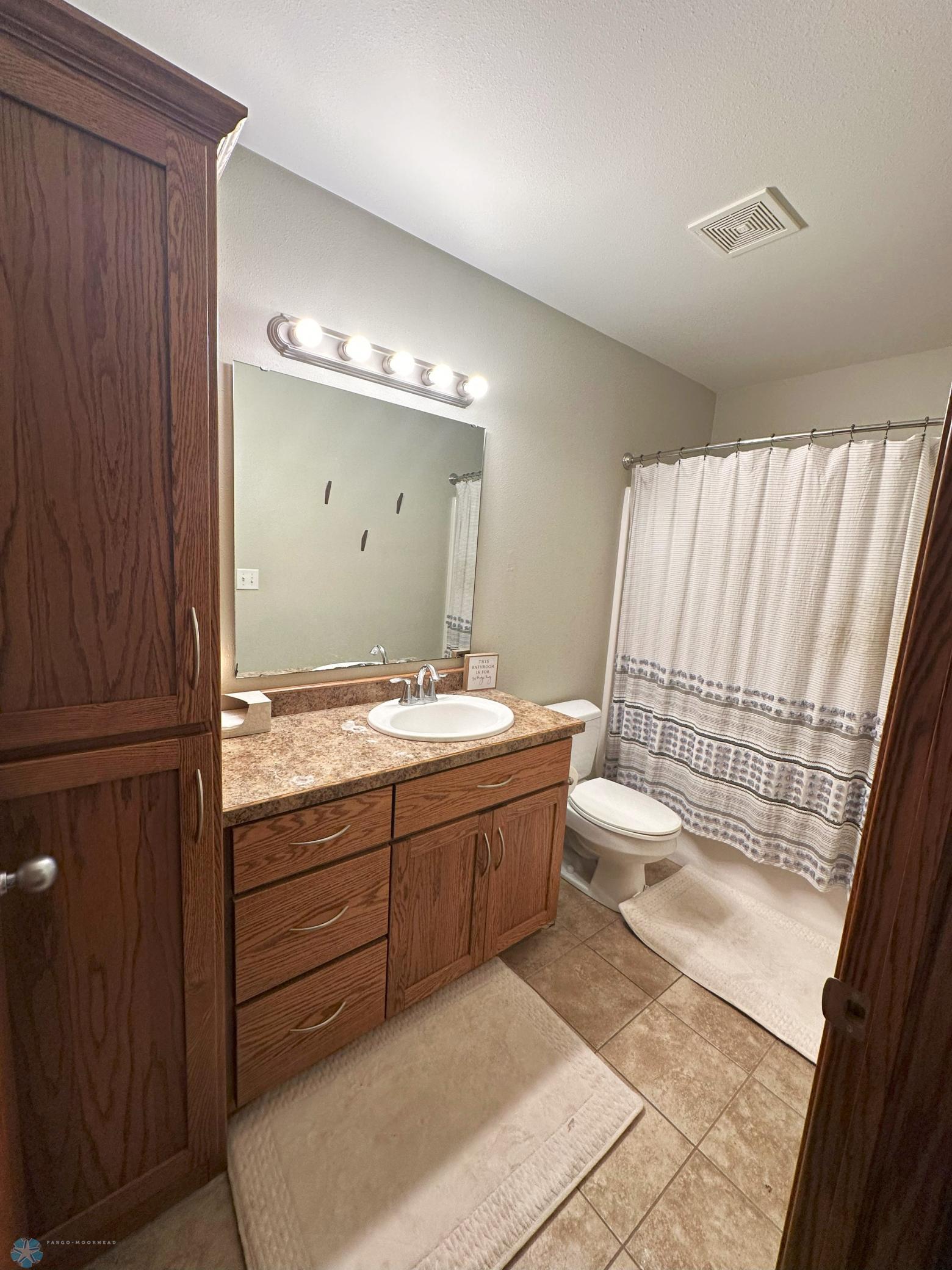 Downstairs Bathroom includes linen cabinet