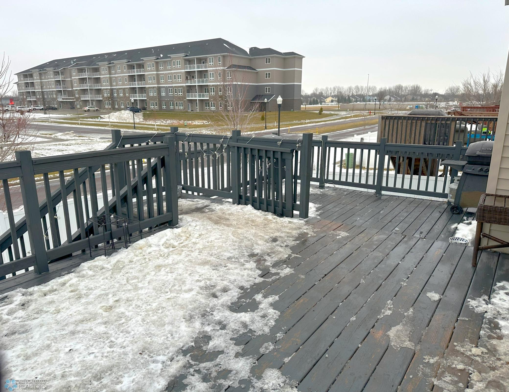 Deck Leads to Fully Fenced Yard