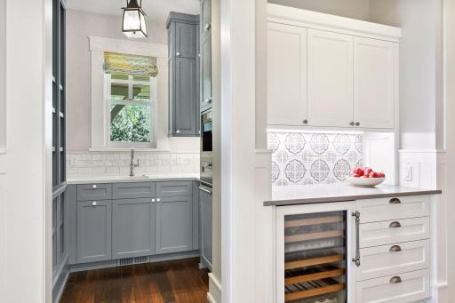 A walk-up beverage bar offers a Sub-Zero beverage refrigerator and wine cooler.