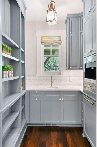 Designed with character and charm, the Butler's Pantry offers a built-in Miele coffee maker, Sub-Zero beverage refrigerator and cabinetry with a custom, blind corner pull out shelving system that utilizes every inch of storage space!