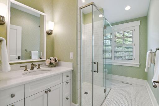 The en suite Bathroom features heated tile floors and a curbless shower with reinforced walls for a future handrailing.
