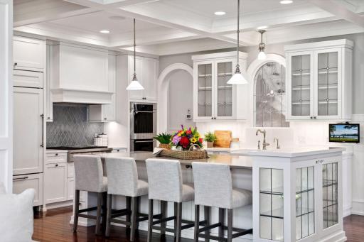 Sure to please the most discerning chef! The Kitchen features custom cabinetry with leaded glass doors, soft-close drawers and doors, and under-cabinet lighting to help you create tasty meals with ease.