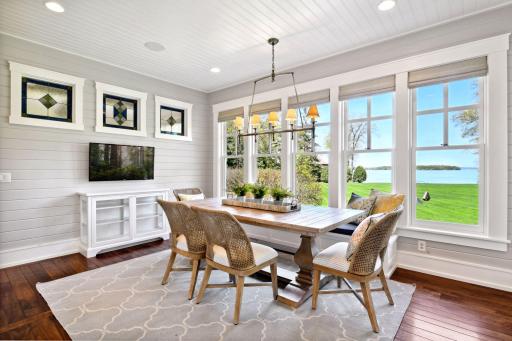 Bathed in natural light with breathtaking views, this sunroom features enameled shiplap walls and an inviting charm that’s sure to make it a favorite retreat.