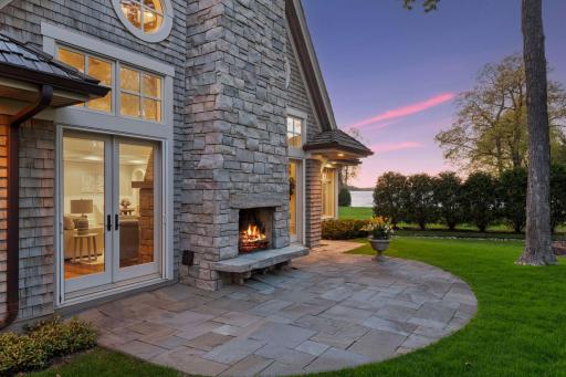 The wood burning outdoor fireplace and paver patio set the stage for relaxing summer evenings under the stars.
