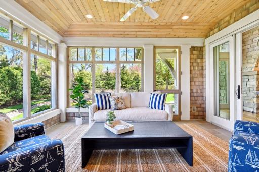Ready for lazy summer days, the Screen Porch features heated bluestone floors, and Somfy motorized shades.