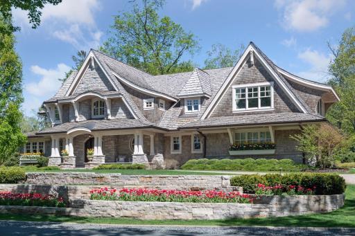 Welcome to 5025 Covington Street! This cottage-style home was designed by Mike Sharratt and offers a little slice of Nantucket in the heart of Greenwood.