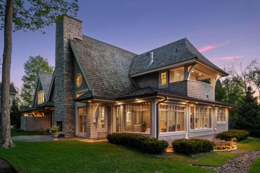 Glowing with warmth, the home is surrounded by well placed lighting.