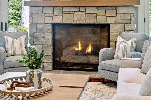 The impressive gas fireplace rises 20-feet to the ceiling and features a beautiful stone surround.