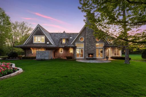 Set against a backdrop of mature trees, the large, level backyard is a private space for relaxing, entertaining or your next game of soccer.