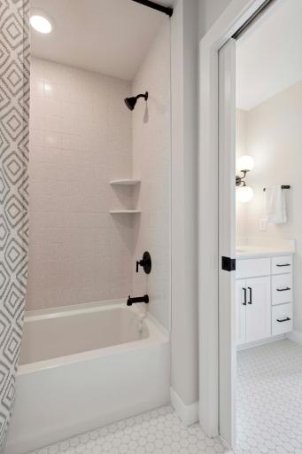 Jack-n-Jill Bathroom with separate vanities!
Photos, virtual/video tours may not depict actual home. Features, materials & finishes shown may contain options that are not included in the price.