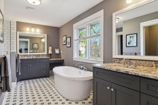 Two separate vanities with sinks for added convenience.