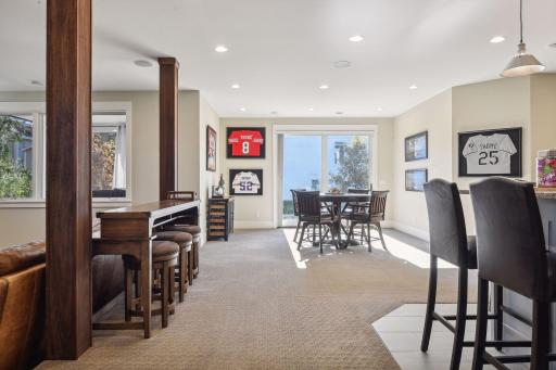 Transition to the other side of the lower level, offering ample space for a game table and casual hangouts