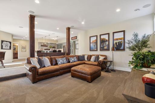 Spacious lower-level living room, offering plenty of room to entertain and relax