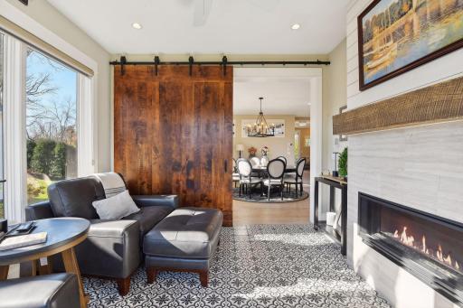 Step into the sunroom through the grand, sliding barn door.