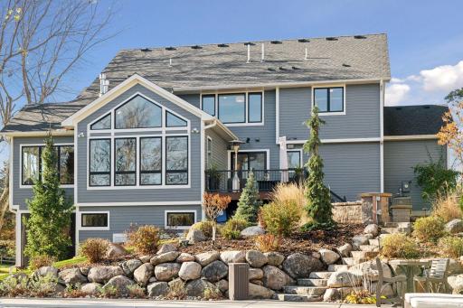 Back side of the house offering tranquil views overlooking the woods, blending nature with comfort.